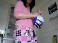 Girl shows her ass and puts something inside