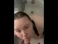 Amateur BBW milf plays in the shower ends in facial