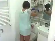 Big ass maid cleaning the bathroom