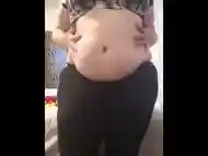 Chubby girl plays with jiggly belly