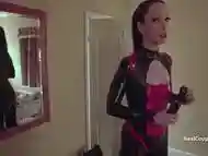 Cross dressing husband with PVC clad wife