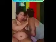 Curvy Latina and Ebony making out and titty sucking while watching Twilight