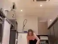 Girl cleaning public kitchen topless