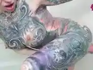 Horny Tattooed Babe Fucks Herself In the Shower