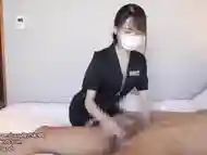 Japanese girl gives a guy a handjob while being facesitting