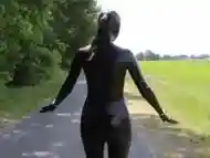 Living rubberdoll walks outdoor Latex