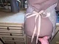 MILF gives handjob in gloves and apron