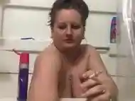 Milf smoking topless in the tub! Smoking a bowl and a cig! 36DD!!