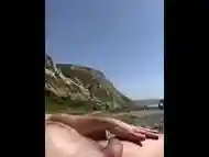 My GF is playing with my dick at the public nude beach till I cum