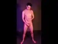 Nude model jacking off during a photo shoot