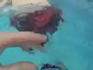 POV of underwater and above rubbing clit of swimmer girl with climax