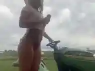 Public Masturbation: blonde babe mows grass then waters it with SQUIRT