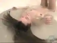 SLUT PLAYS WITH HERSELF IN BATHTUB