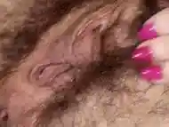 Sexy and hairy babe Anya fingers her pink wet pussy until her bush is soaked