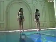 Sexy babes with big tits swim underwater in the pool