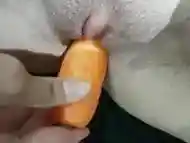 Sexy slut fucking herself with a carrot