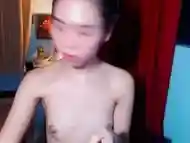She is an Asian Ladyboy trap doing her thing for her cam fans