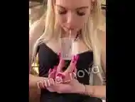 Sick girl is hocking and spitting loogies phlegm snot and mucus into the glass