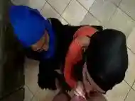 Two Muslim hijab woman on their knees sucking dick and getting their faces covered with cum