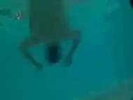 Underwater swimming with jockstrap in hotel pool