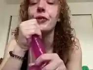 giving this dildo a sloppy blowjob