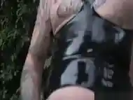 Tattooed latex tgirl pulling hard cock solo