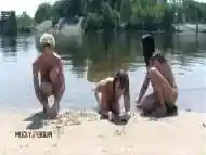 Curvaceous nudist teens strolls around  on the beach and enjoys a sunny day