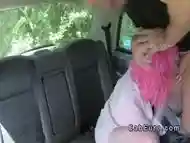 Pink haired hottie deep throats in fake taxi