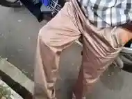 Shiny satin khaki pants trousers caught in public