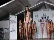 Beautiful models move on the catwalk in flimsy bikinis