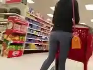 Girl in gray leggings at the electronics store