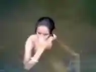 Naked Indian amateur teen swims in the river