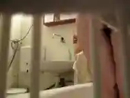 Secretly filming as she showers off