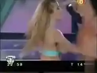 Short skirt girl dances on TV and flashes booty