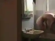 Sweet girl masturbates in the bathtub