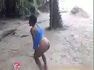 Black girl half naked in an island enjoying herself