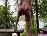 Nude MILF with huge octopus tattoo on butt walks naked in public park and shows her kraken close up