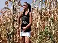 Pee in a field of corn - pissing herself while talking with her boyfriend on the phone