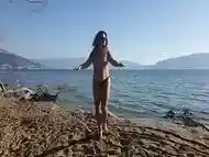 Sexy Naked Girl Seduces Guy on the Beach