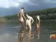 Teen babes get cumshots by the river