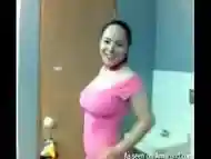 Busty Latina in pink strips in the bathroom