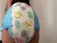 Cute Diaper Girl wets her Diaper