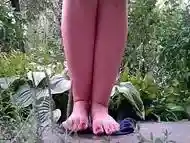 Hot MILF stepmom pissing outdoors with her legs spread wide
