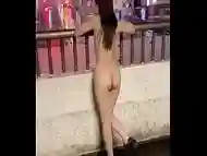 NANA seems to be enjoying being completely naked in front of the station, and she stops a taxi completely naked!