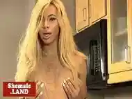 Petite ebony tranny tugs on her hard cock