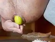 Playing with a lemon and cum