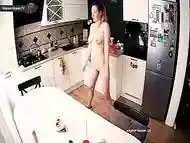 Real Gorgeous Female Makes Exercise at Kitchen