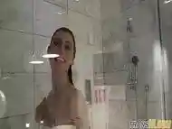 Smalltitted tranny showering while filmed