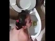 Toilet receiving a golden shower and sucks dick | face slapping and spitting