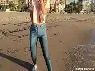 Wet shoot on a public beach with Crazy Model. Risky outdoor masturbation. Foot fetish. Pee in jeans.